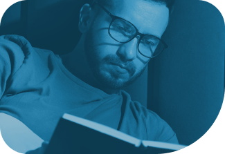 Person with presbyopia reading at home