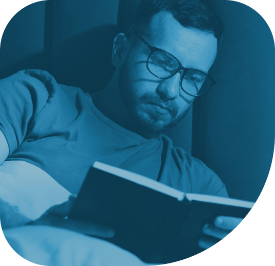 Person with presbyopia reading at home