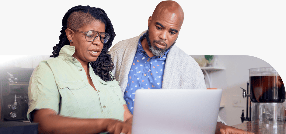 Woman with presbyopia and her partner looking at a computer screen