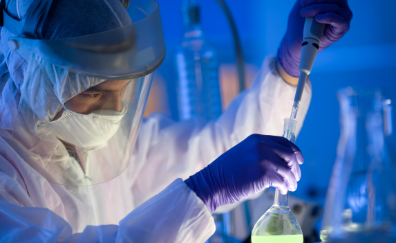 Scientist with beaker tube